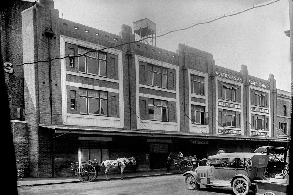 Photograph of Sydney Municipal Council Stores Building, with a horse and cart an